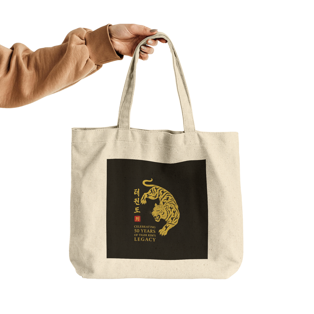 Tiger_Kims_Academy_50th_Anniversary_Leg_CottonTote_L_HandTransparent_Mockup.png