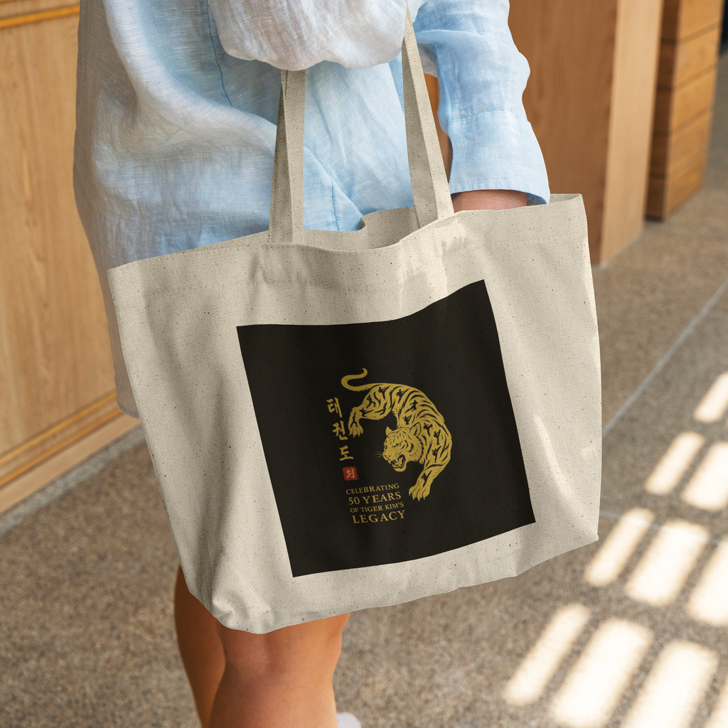 Tiger_Kims_Academy_50th_Anniversary_Leg_CottonTote_L_WomanDigging_Mockup.png